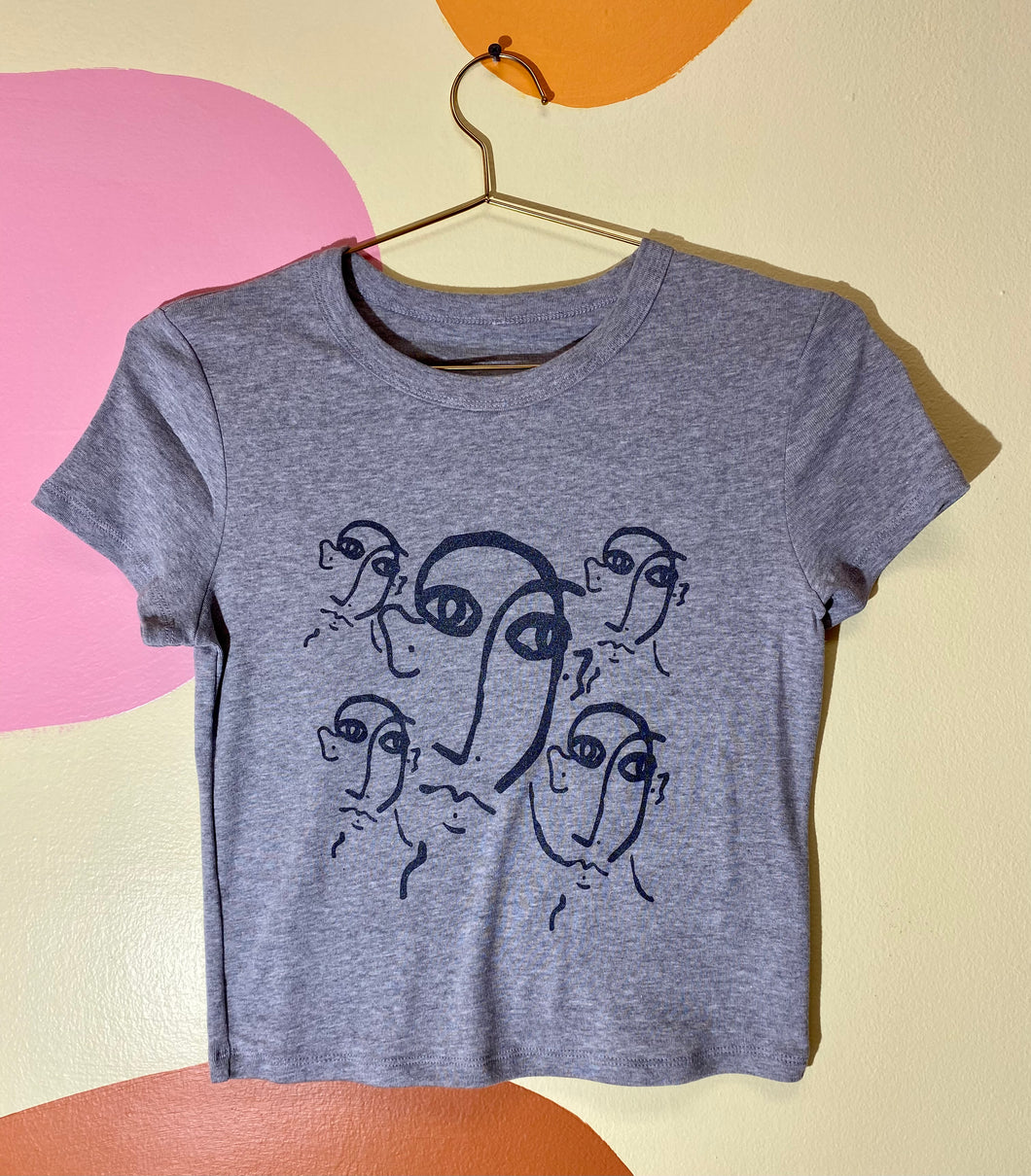 Faces on faces grey baby tee
