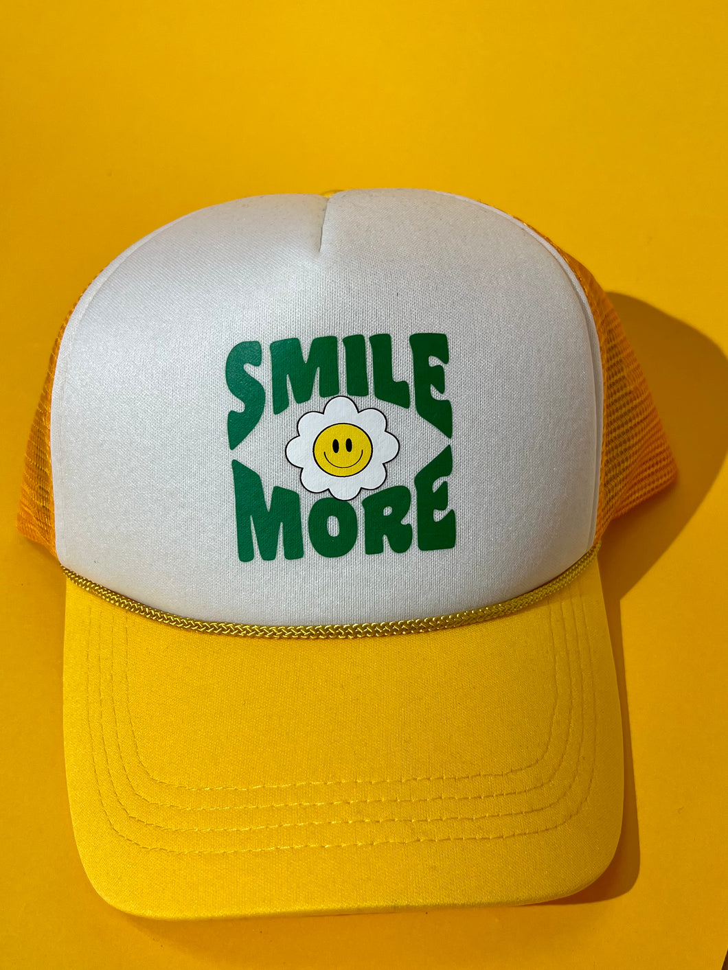 Smile more mustard trucker hat